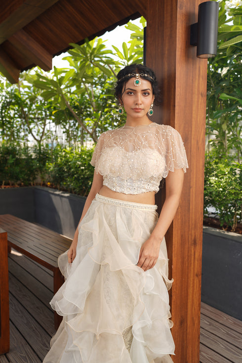 Cape with ruffle skirt