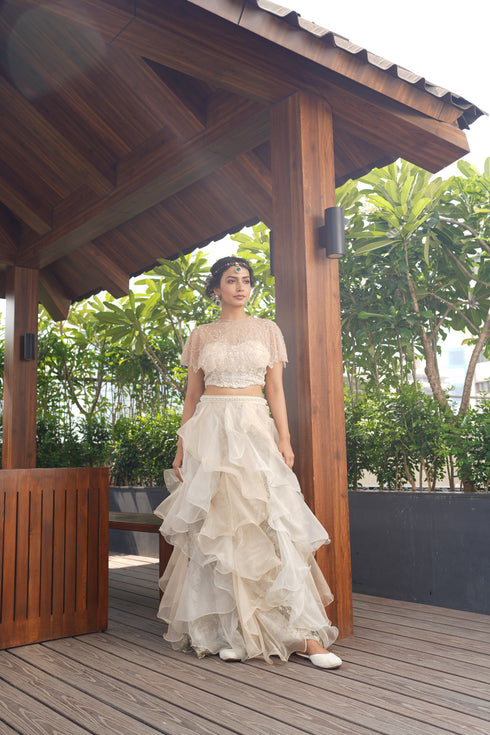 Cape with ruffle skirt