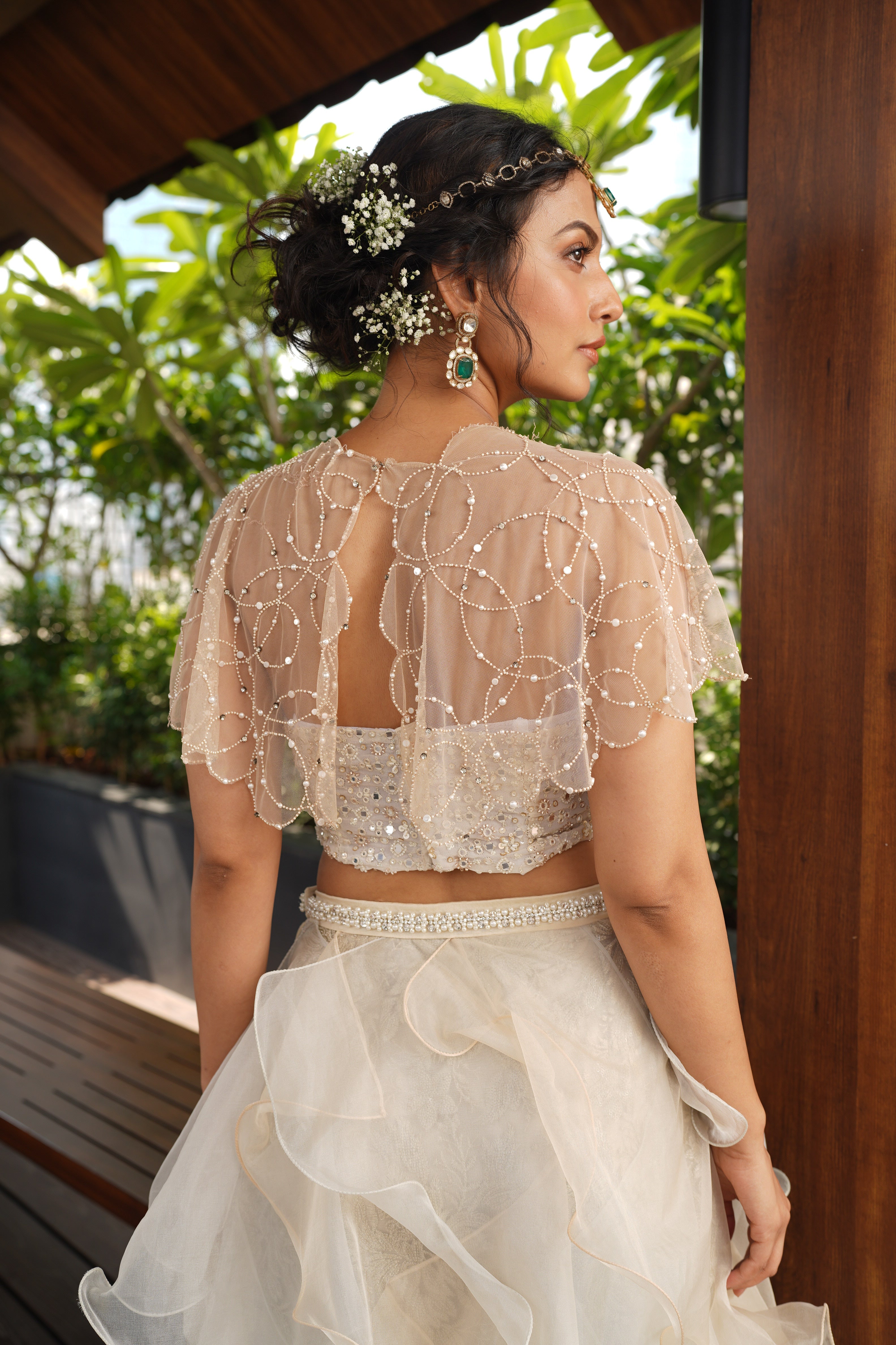 Cape with ruffle skirt